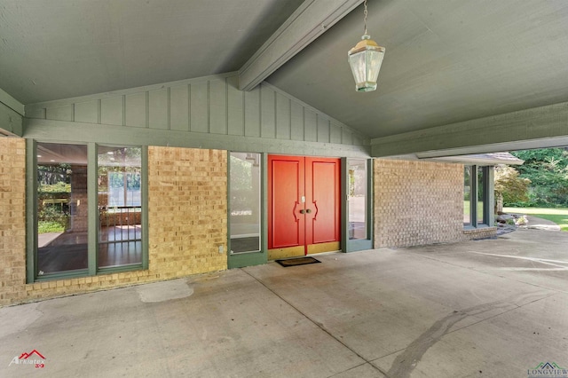 3408 Airline Rd, Longview, TX 75605 - doorway to property with board and batten siding, brick siding, and a patio area