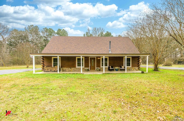 view of front of property with covered porch and a front lawn