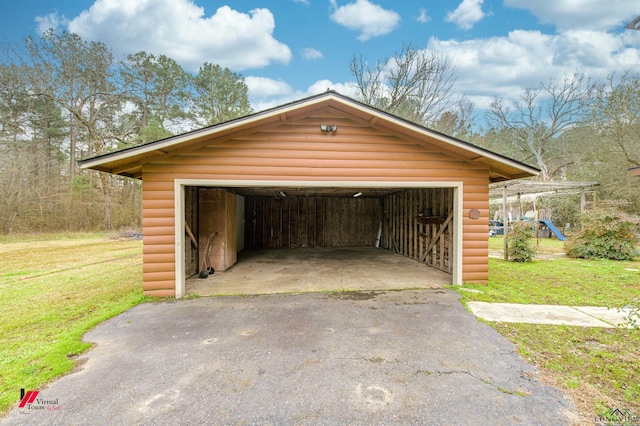 garage featuring a yard