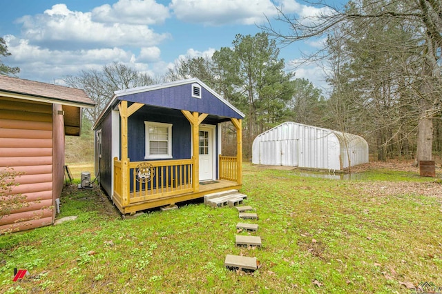 view of outbuilding with a yard