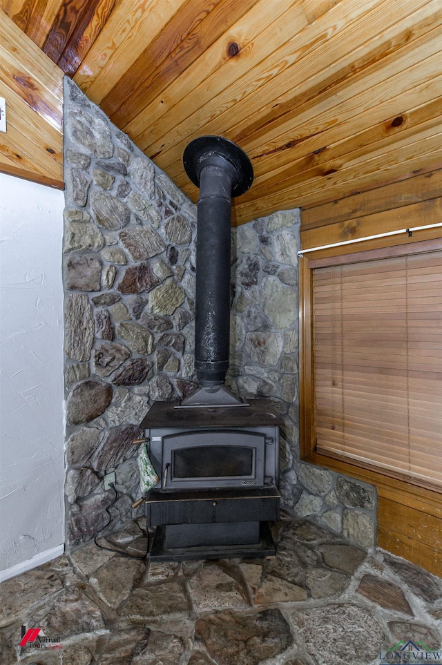 details with wood ceiling and a wood stove