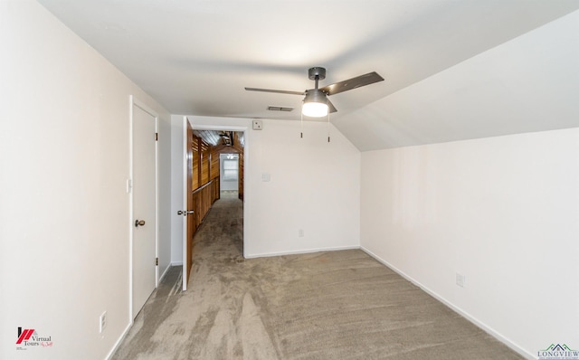 bonus room featuring lofted ceiling, ceiling fan, and light colored carpet