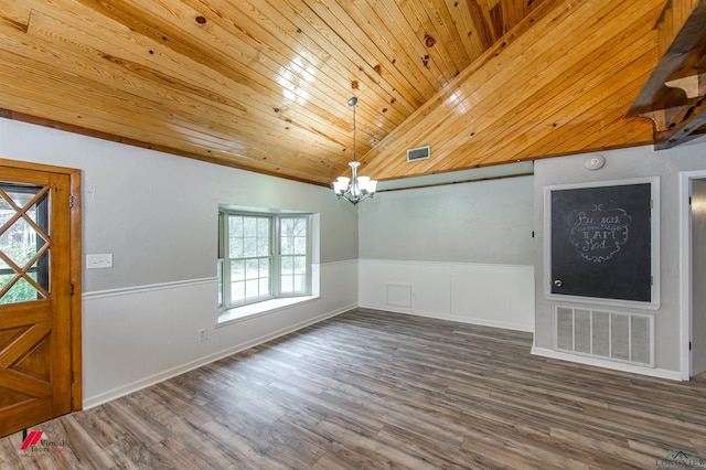 entrance foyer featuring an inviting chandelier, hardwood / wood-style flooring, wooden ceiling, and vaulted ceiling