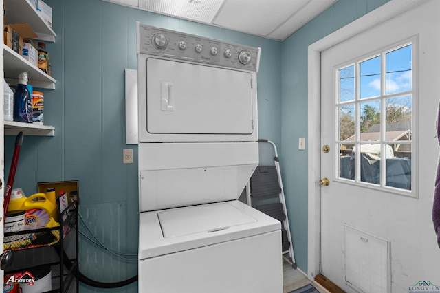 laundry area featuring laundry area and stacked washing maching and dryer