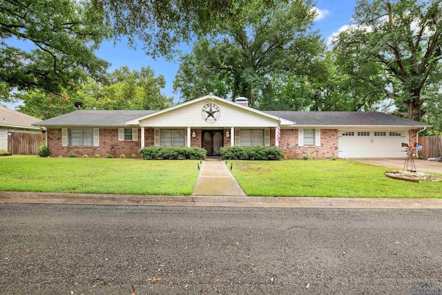 single story home with a front yard and a garage