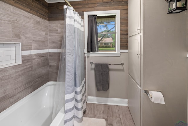 bathroom featuring shower / bathtub combination with curtain