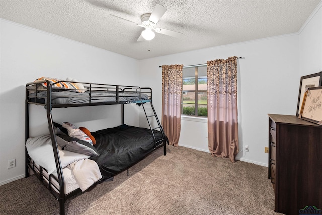 bedroom featuring light carpet, a textured ceiling, ceiling fan, and ornamental molding