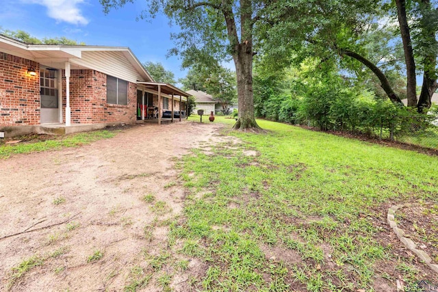 view of yard featuring a carport