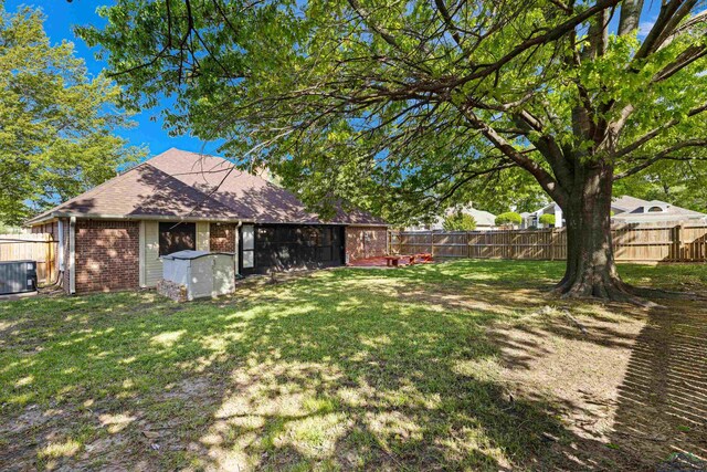 504 Lakewood Dr, Longview, TX 75604 - view of yard featuring a fenced backyard and central AC unit