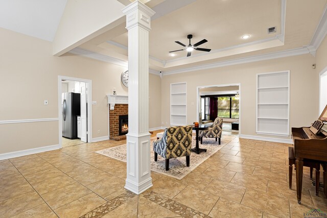 504 Lakewood Dr, Longview, TX 75604 - living room featuring ornamental molding, built in shelves, and decorative columns