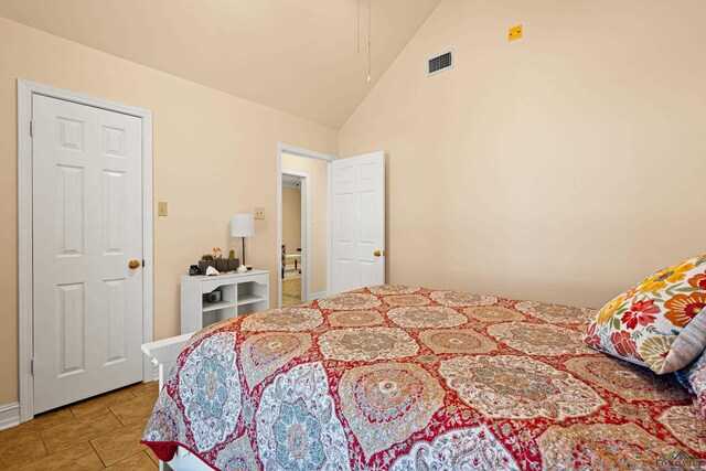 504 Lakewood Dr, Longview, TX 75604 - bedroom with high vaulted ceiling, visible vents, and light tile patterned floors