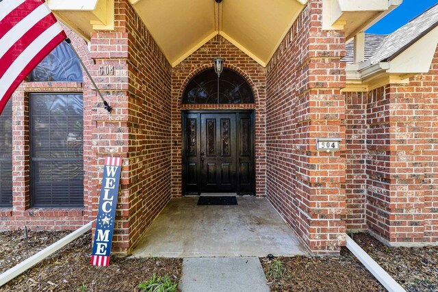 504 Lakewood Dr, Longview, TX 75604 - view of exterior entry with brick siding