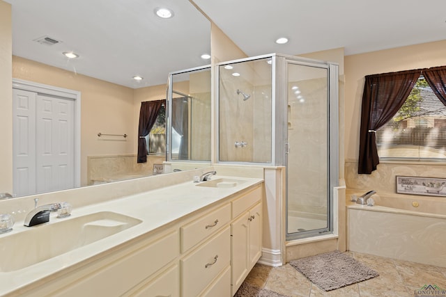 504 Lakewood Dr, Longview, TX 75604 - bathroom with a sink, a bath, double vanity, and a stall shower