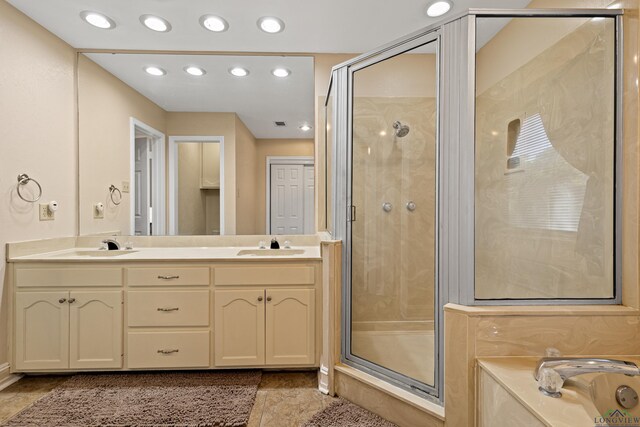 504 Lakewood Dr, Longview, TX 75604 - full bath with recessed lighting, double vanity, a stall shower, and a washtub