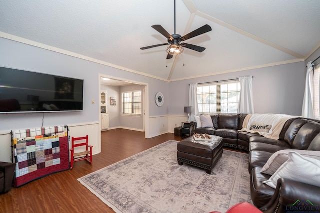 living room featuring hardwood / wood-style flooring, crown molding, ceiling fan, and lofted ceiling