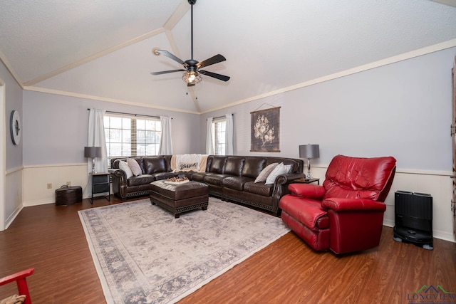 living room featuring ceiling fan, dark hardwood / wood-style flooring, crown molding, and vaulted ceiling