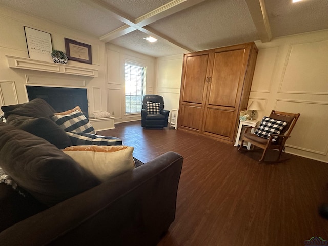 living room with beam ceiling, a textured ceiling, dark wood-type flooring, and coffered ceiling