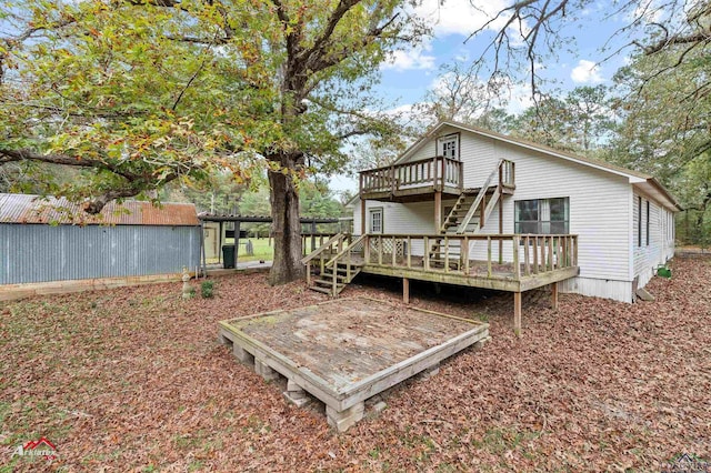 back of house featuring a deck