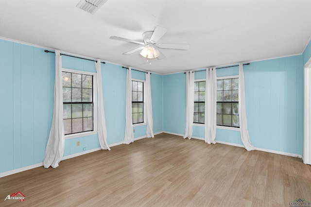 unfurnished room featuring ceiling fan and light hardwood / wood-style flooring