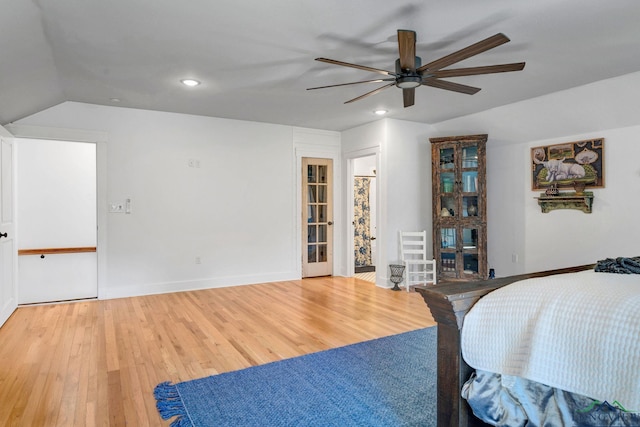 bedroom featuring lofted ceiling, ceiling fan, and hardwood / wood-style flooring