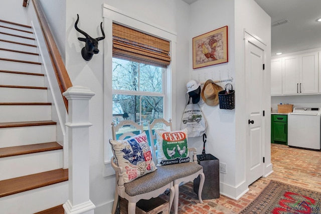 sitting room featuring washer / clothes dryer