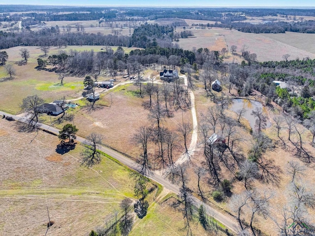 birds eye view of property with a rural view