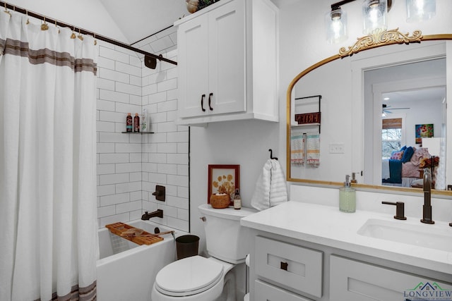 full bathroom featuring toilet, vaulted ceiling, shower / bath combo with shower curtain, ceiling fan, and vanity