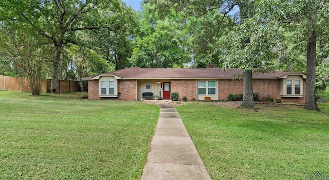 ranch-style home featuring a front yard