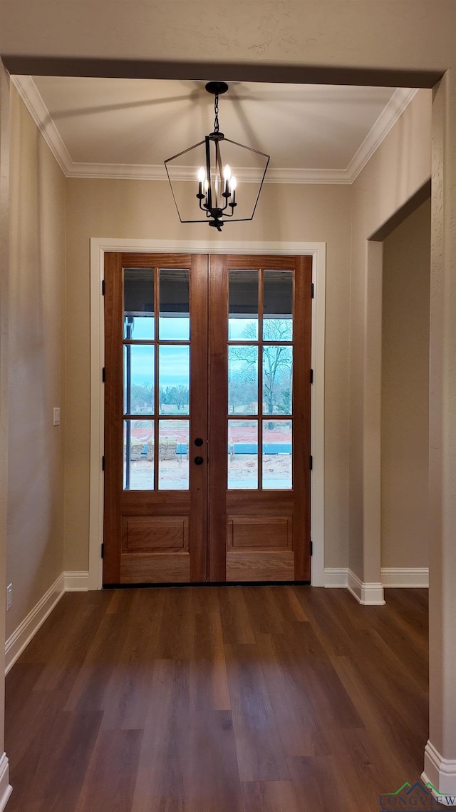 doorway with baseboards, ornamental molding, dark wood-style flooring, french doors, and a notable chandelier