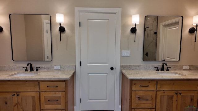 bathroom featuring two vanities and a sink