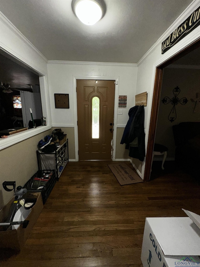 foyer entrance featuring wood finished floors and ornamental molding