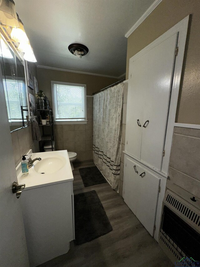 bathroom with vanity, tile patterned flooring, ornamental molding, and toilet