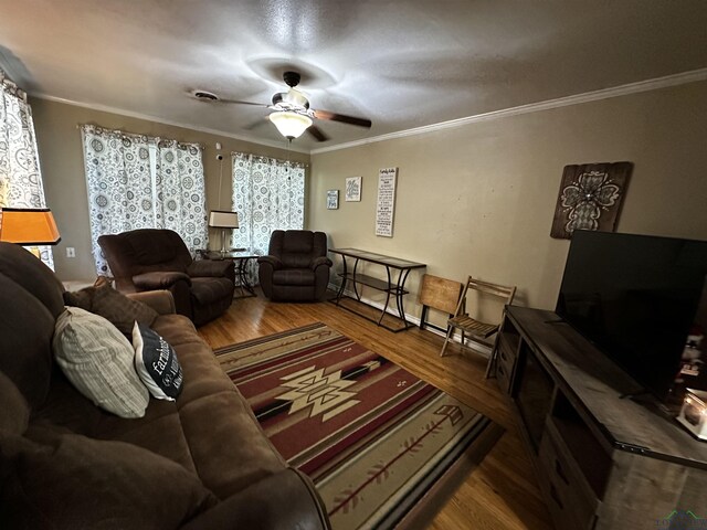 bathroom with heating unit, wood finished floors, ornamental molding, and toilet