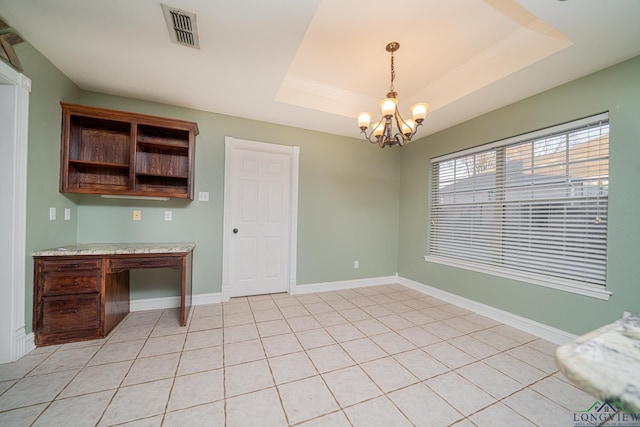 unfurnished dining area featuring ornamental molding, a chandelier, light tile patterned floors, and a raised ceiling