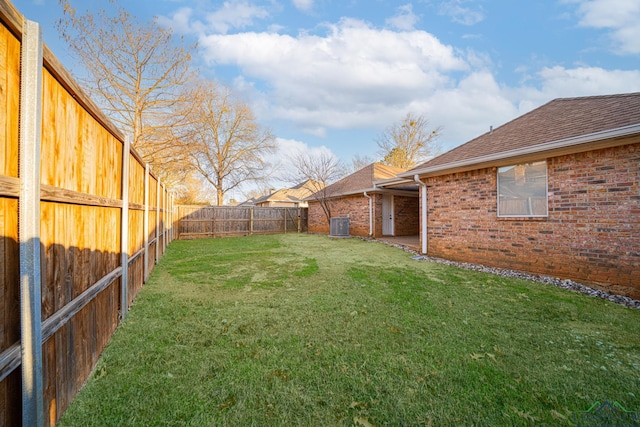 view of yard with central AC unit