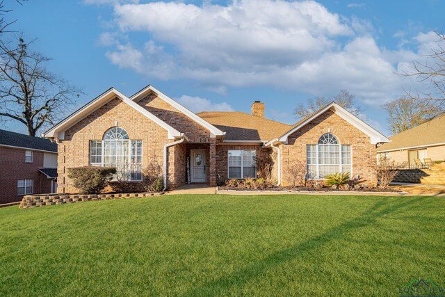 ranch-style house with a front yard