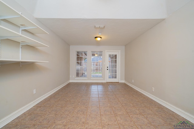 empty room featuring light tile patterned floors