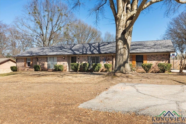 ranch-style house with brick siding