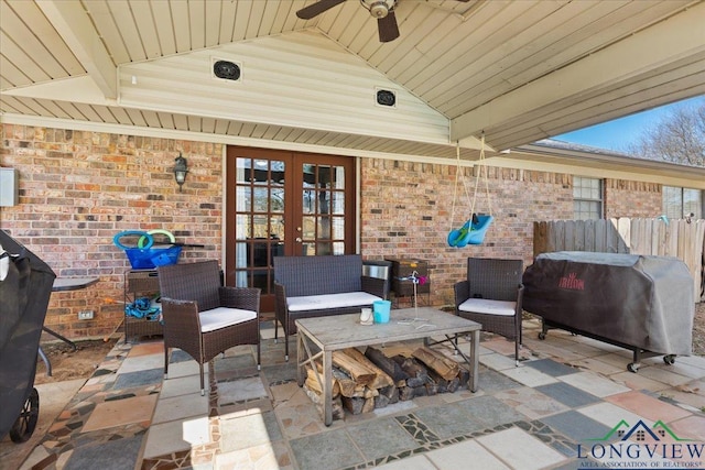 view of patio / terrace featuring ceiling fan, outdoor lounge area, fence, french doors, and grilling area