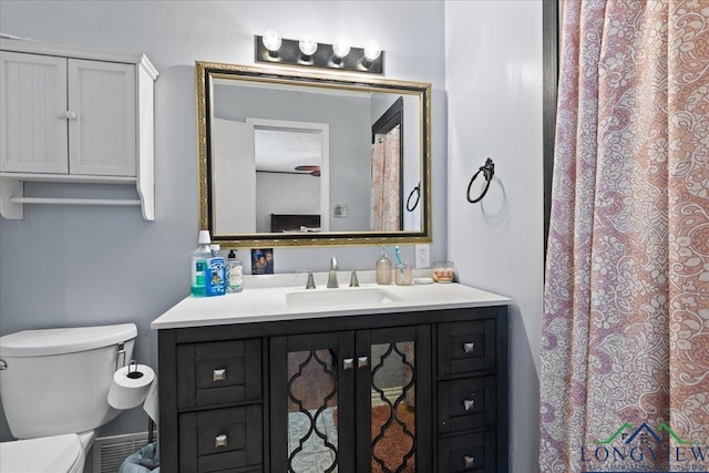 bathroom with vanity and toilet