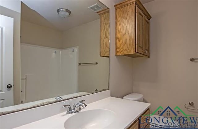 bathroom featuring visible vents and vanity