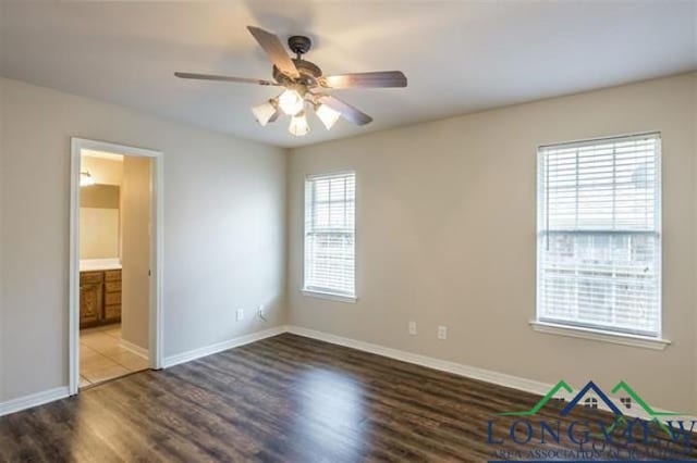 unfurnished bedroom with baseboards and wood finished floors
