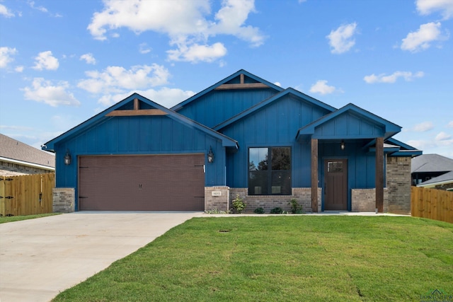 craftsman-style home featuring a garage and a front lawn