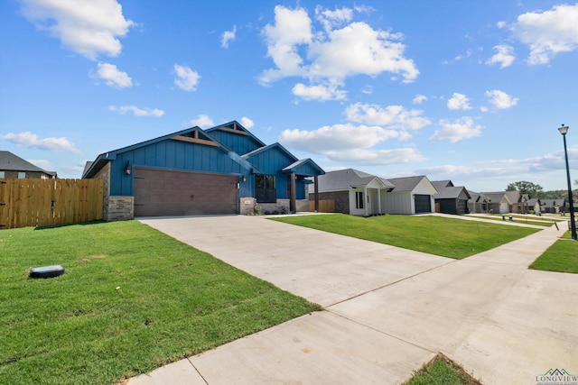 view of front of house featuring a front yard and a garage