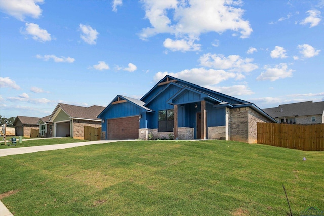 craftsman house featuring a garage and a front yard