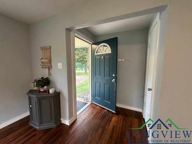  - foyer entrance with wood finished floors and baseboards