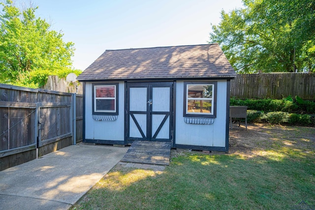 view of outdoor structure with a lawn