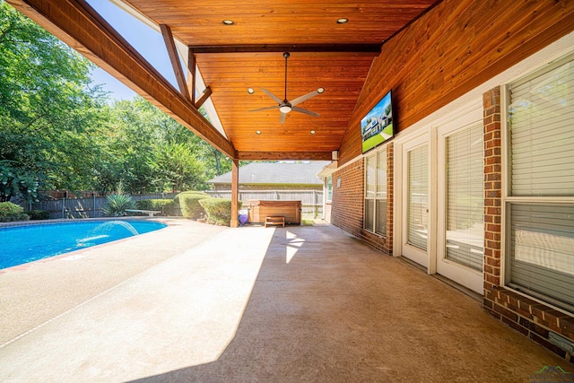 view of swimming pool with a patio area, ceiling fan, and a jacuzzi