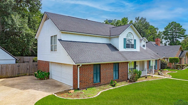 view of front of house featuring a porch, a garage, and a front yard