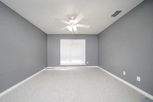 carpeted empty room featuring ceiling fan